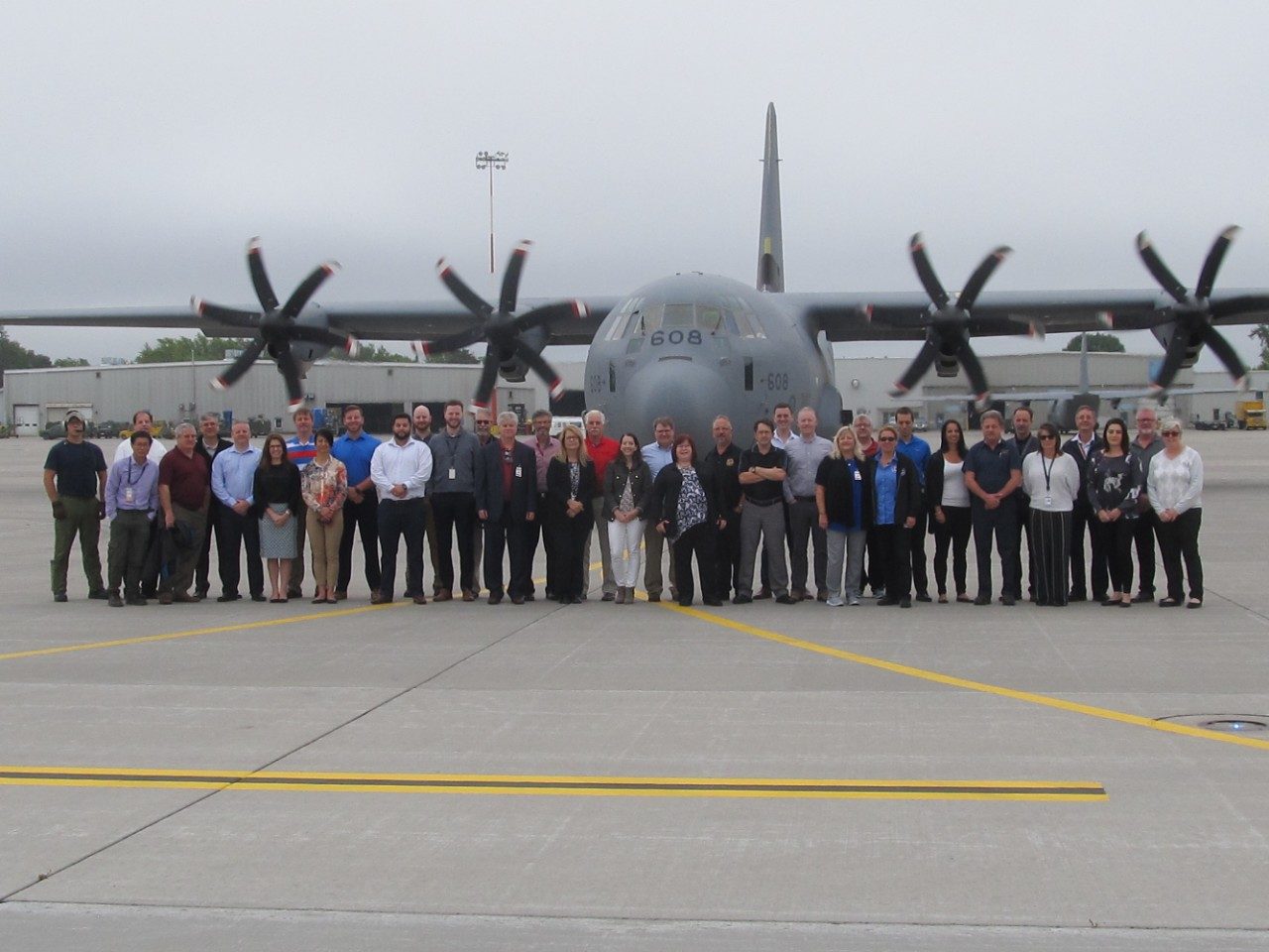 C130J Canada team standing in front of C130j